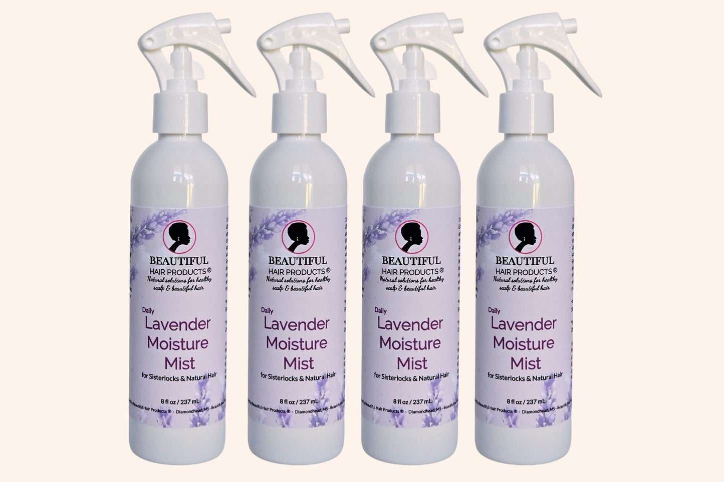 Four bottles of Lavender Daily Moisture Mist bottle, 8oz with purple and cream label featuring lavender for Sisterlocks therapeutic care