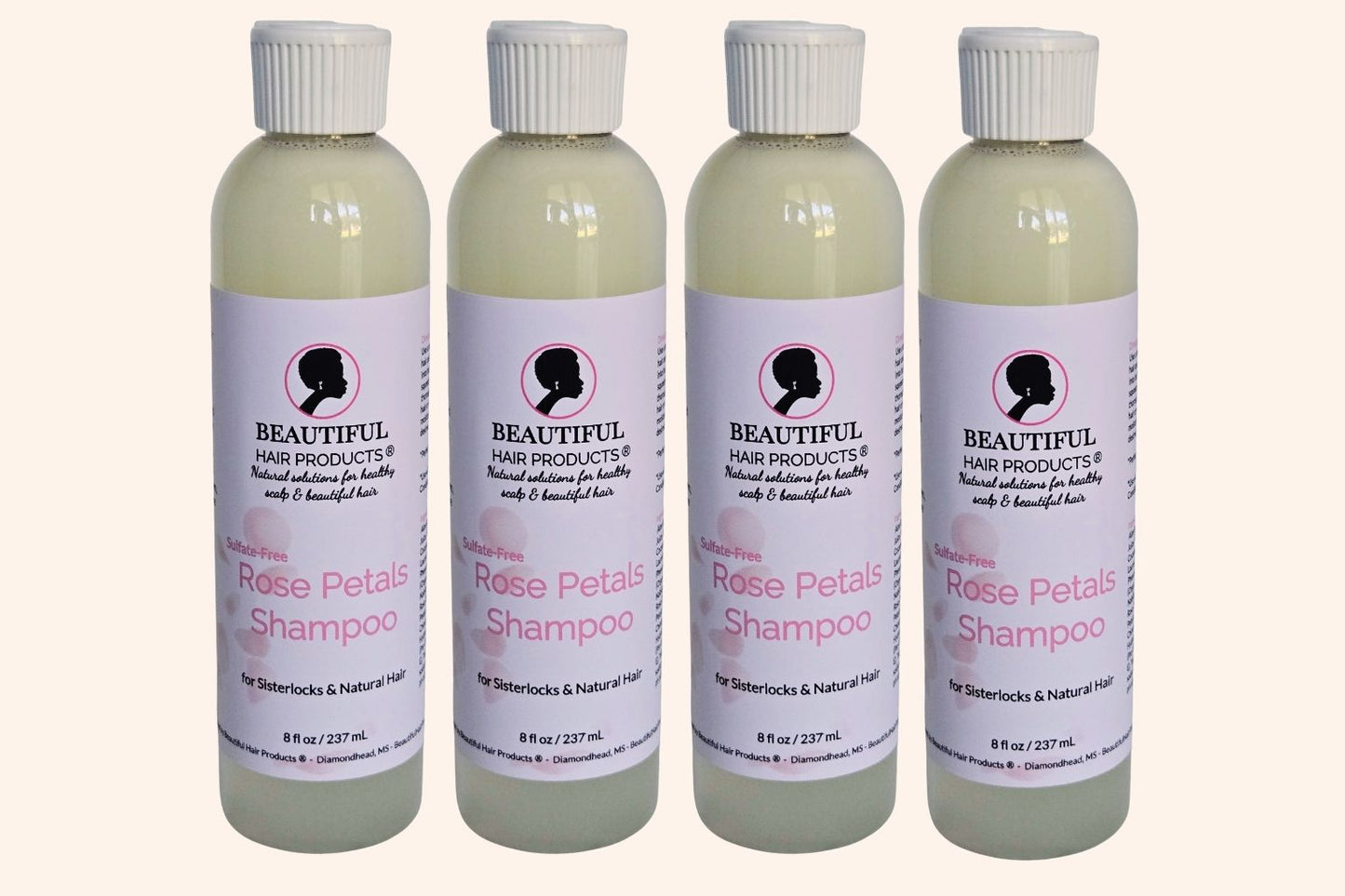Four bottles of Rose Petals Sulfate-Free Shampoo 8oz bottle with pink and cream label for gentle medium porosity hair cleansing