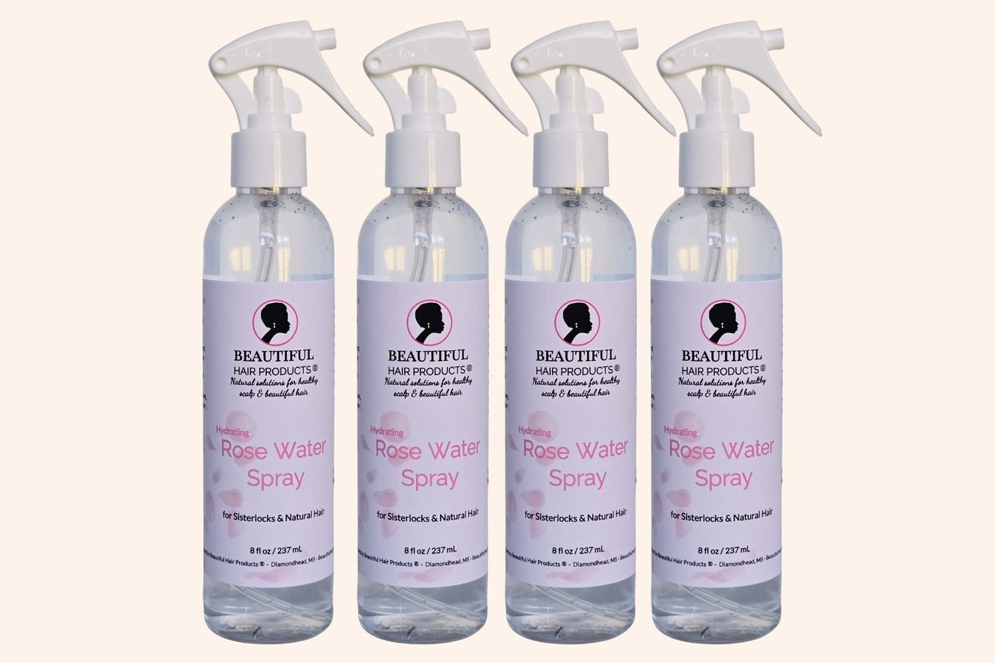 Four bottles of Rose Water Hydrating Spray 8oz bottle with pink and cream label for daily moisture mist for medium porosity hair