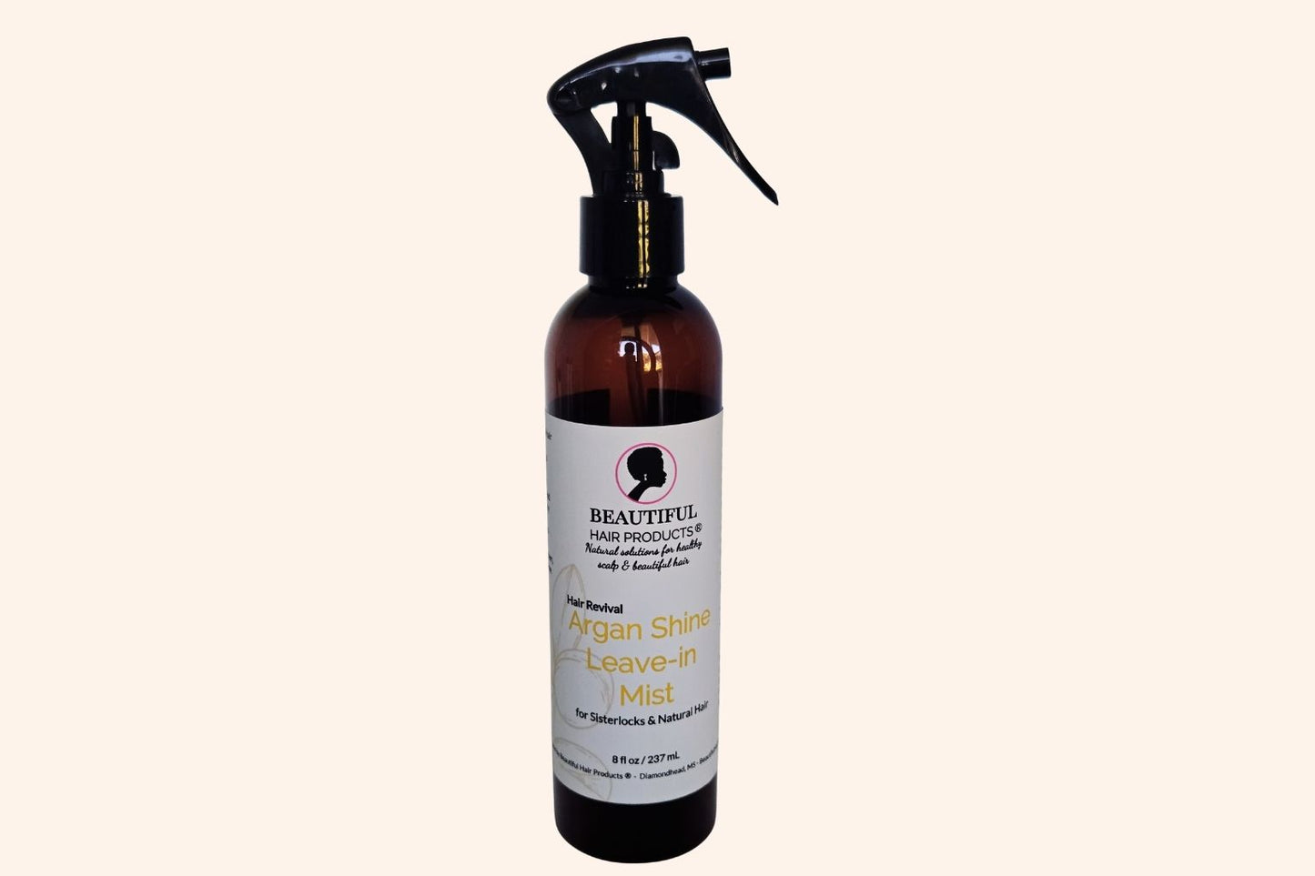 Argan Shine Revival Leave-In Mist bottle, 8oz with gold and cream label featuring argan for medium porosity shine enhancement