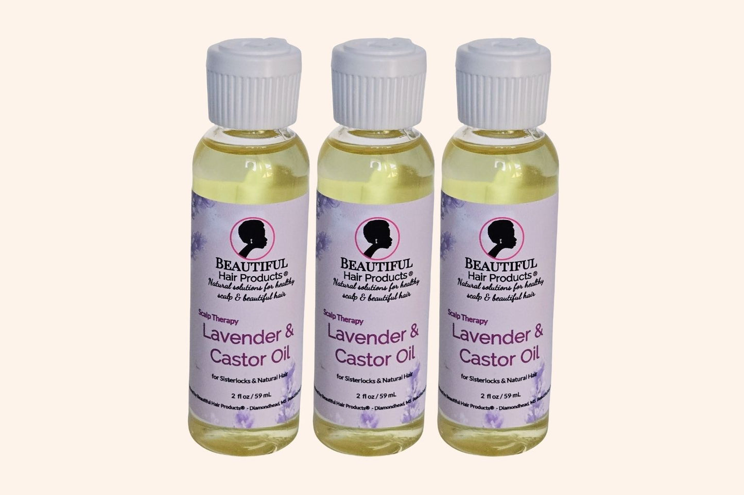 Three bottles Lavender & Castor Scalp Therapy Oil, with purple and cream label for therapeutic scalp treatment