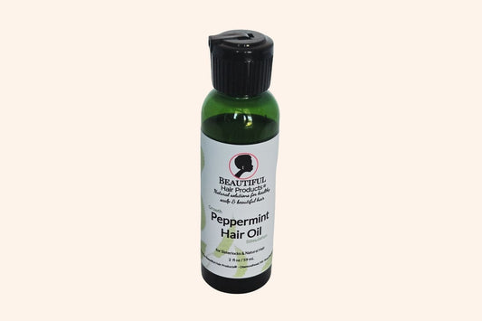 Peppermint Hair Growth Oil 2oz bottle with green and cream label for stimulating scalp treatment
