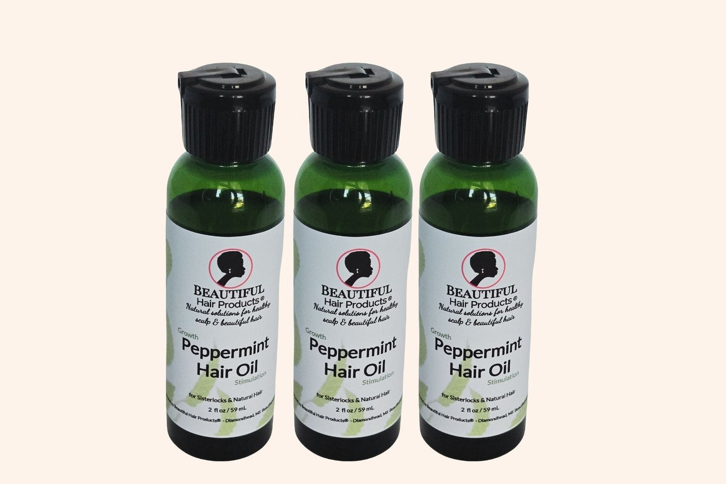 Three bottles of Peppermint Hair Growth Oil 2oz bottle with green and cream label for stimulating scalp treatment