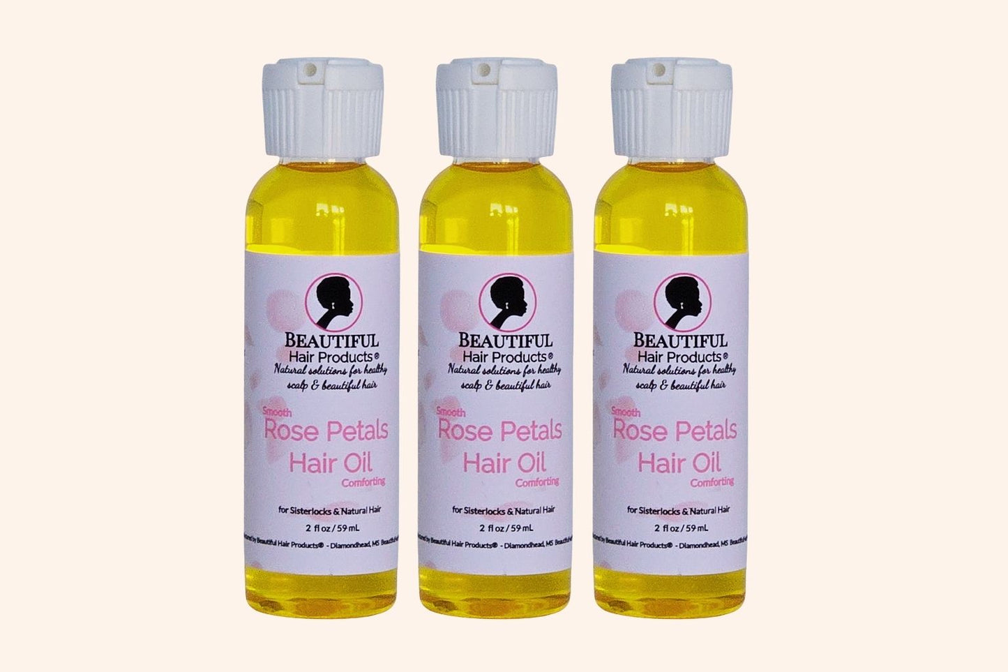 Three bottles  Rose Petals Scalp & Hair Oil bottle, 2oz with pink and cream label featuring rose petals for scalp and hair nourishment