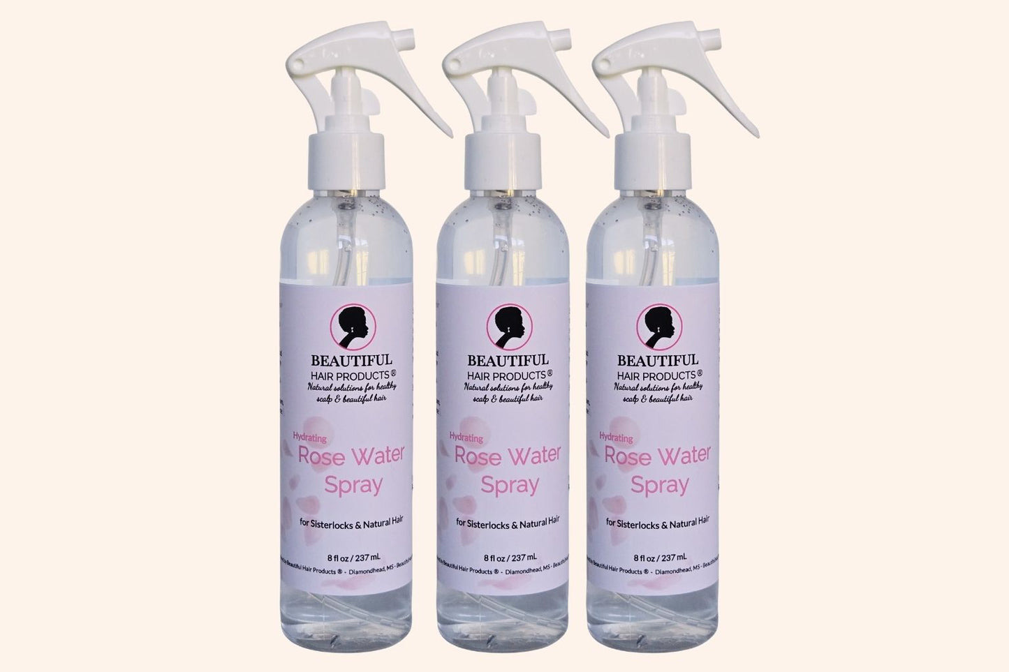 Three bottles of Rose Water Hydrating Spray 8oz bottle with pink and cream label for daily moisture mist for medium porosity hair